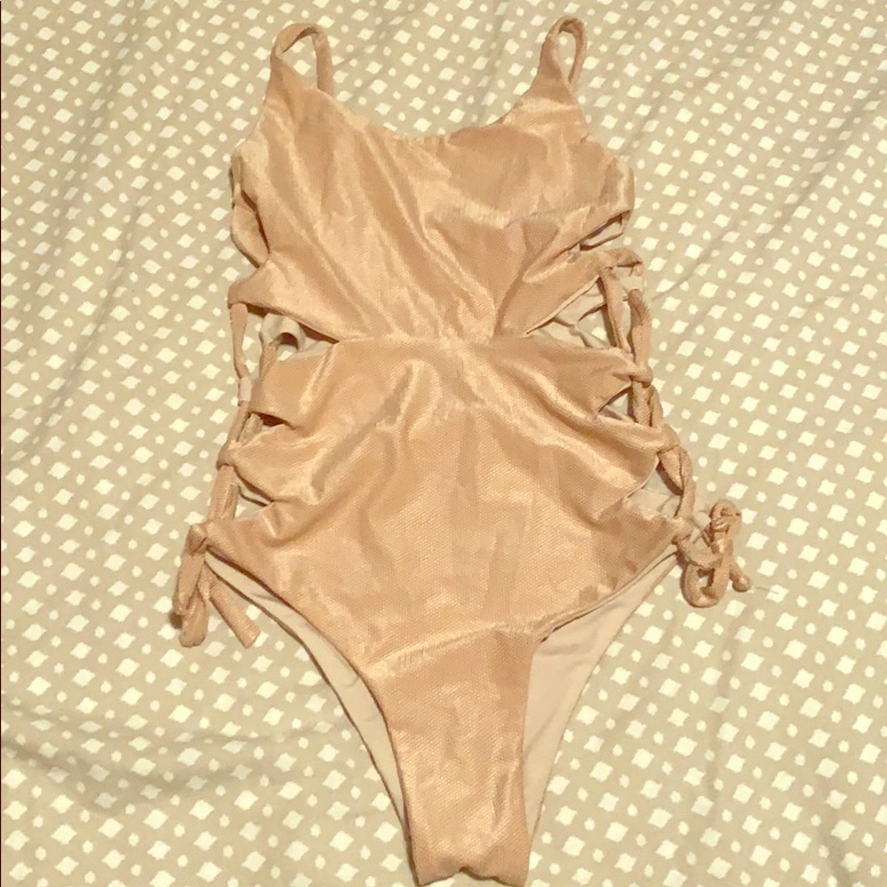 NWT Maylana lace up sides rose gold one piece.